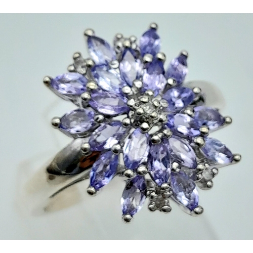 1222 - A STERLING SILVER DIAMOND & IOLITE SET MARQUISE SHAPED CLUSTER RING. TOTAL WEIGHT 4.2G. SIZE P