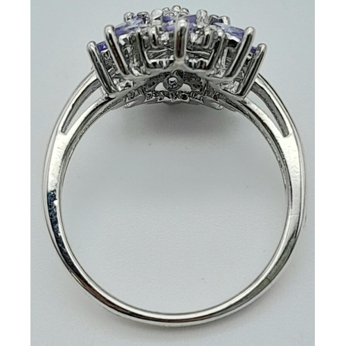 1222 - A STERLING SILVER DIAMOND & IOLITE SET MARQUISE SHAPED CLUSTER RING. TOTAL WEIGHT 4.2G. SIZE P