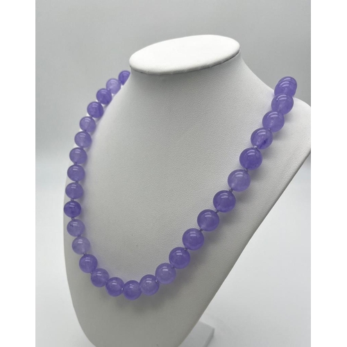 382 - A Lavender Jade Large Bead Necklace. Gilded clasp. 12mm beads. 56cm necklace length.