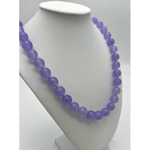 382 - A Lavender Jade Large Bead Necklace. Gilded clasp. 12mm beads. 56cm necklace length.