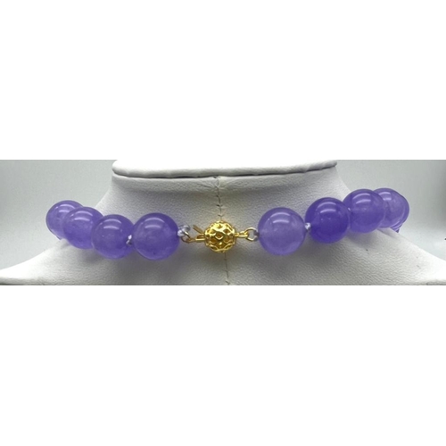 382 - A Lavender Jade Large Bead Necklace. Gilded clasp. 12mm beads. 56cm necklace length.