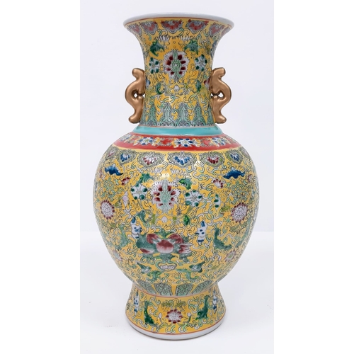 412 - A large Chinese Famille Jaune Imperial Yellow Vase. Early 20th Century, marked on the base and stand... 