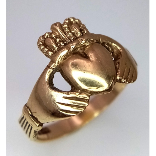 755 - A 9K YELLOW GOLD CLADDAGH RING. 3.2G. SIZE O