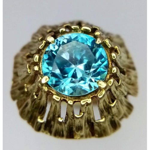 333 - A Vintage 14K Yellow Gold and Ice Blue Zircon Ring. A hypnotising central stone at the Apex of a Gol... 