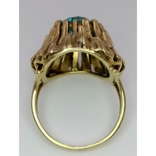 333 - A Vintage 14K Yellow Gold and Ice Blue Zircon Ring. A hypnotising central stone at the Apex of a Gol... 