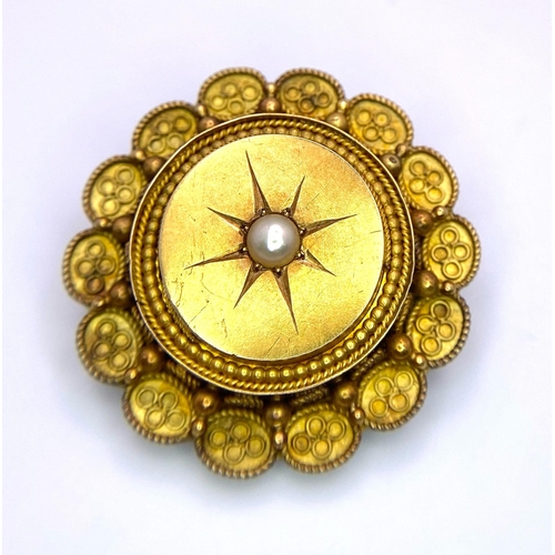 123 - An Antique 15K Yellow Gold and Pearl Mourning Brooch. Centre pearl with circle and oval decoration. ... 