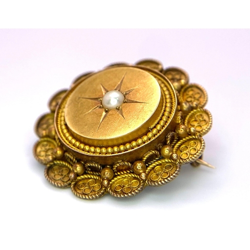 123 - An Antique 15K Yellow Gold and Pearl Mourning Brooch. Centre pearl with circle and oval decoration. ... 