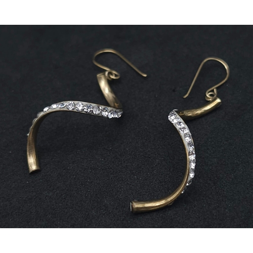 1797 - A Pair of 9K Yellow Gold and White Stone Twist Dangle Earrings. 0.9g total weight.