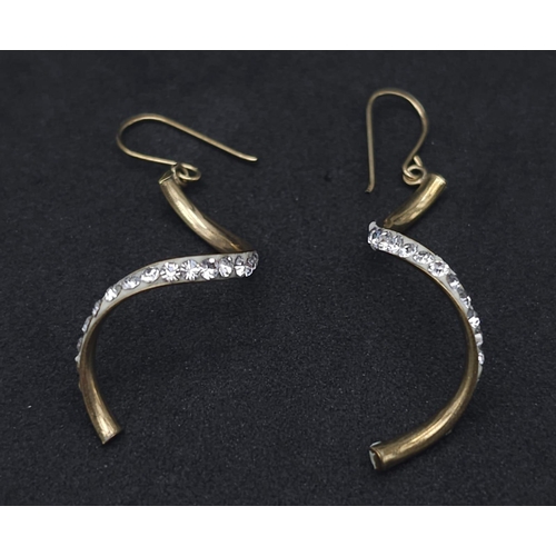 1797 - A Pair of 9K Yellow Gold and White Stone Twist Dangle Earrings. 0.9g total weight.