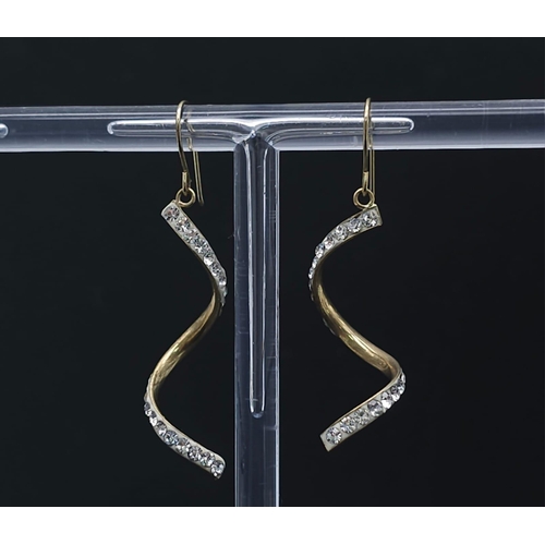 1797 - A Pair of 9K Yellow Gold and White Stone Twist Dangle Earrings. 0.9g total weight.