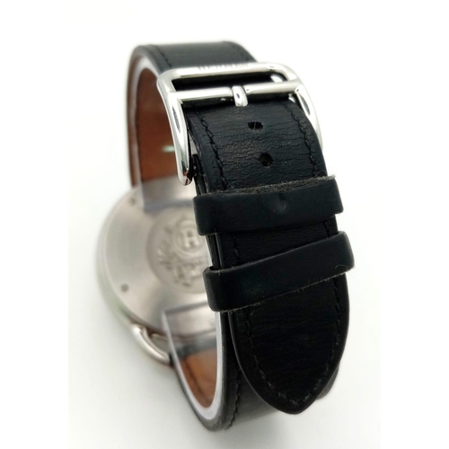 248 - A HERMES OF PARIS STAINLESS STEEL AUTOMATIC GENTS WRIST WATCH ON A BLACK LEATHER STRAP WITH SILVERTO... 