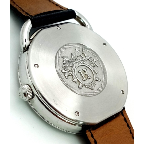 248 - A HERMES OF PARIS STAINLESS STEEL AUTOMATIC GENTS WRIST WATCH ON A BLACK LEATHER STRAP WITH SILVERTO... 