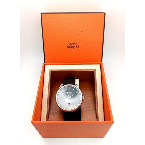 248 - A HERMES OF PARIS STAINLESS STEEL AUTOMATIC GENTS WRIST WATCH ON A BLACK LEATHER STRAP WITH SILVERTO... 