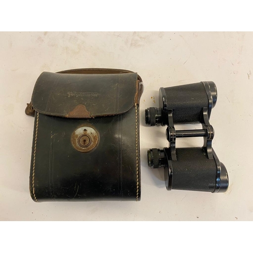 306 - A Pair of WW2 German 6 x 30 Binoculars in Leather Case. Optics are good. The latch on the case are b... 