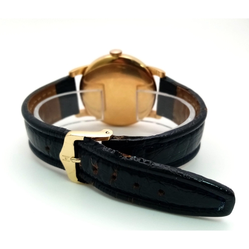 395 - A Vintage 18K Gold Cased International Watch Co. Shaffhausen Gents Watch. Black leather strap. 18k g... 