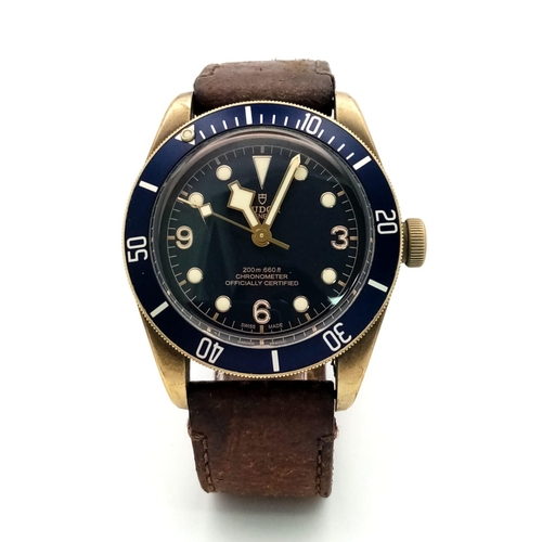 66 - A TUDOR CHRONOMETER GENTS WRISTWATCH WITH BLUE DIAL AND MATCHING BEZEL .  44mm    14758