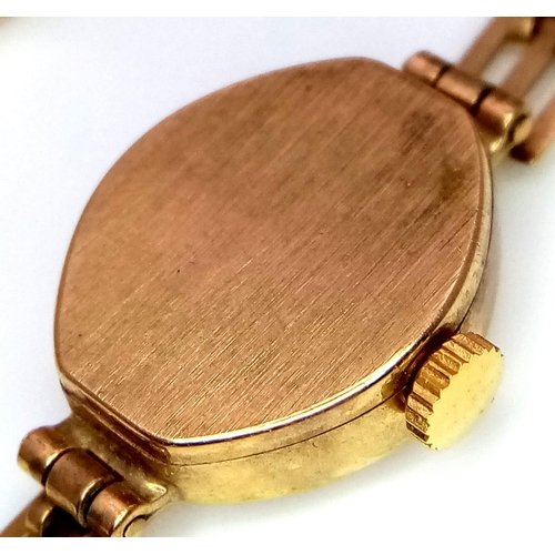 89 - A Vintage 9K Gold RJW Ladies Watch. 9k gold link bracelet. 9K gold oval case - 15mm. Gold tone dial.... 