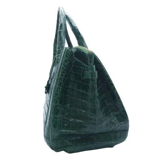 110 - Nancy Gonzalez Crocodile Handbag.
Rich, emerald green crocodile leather exterior with gold tone hard... 