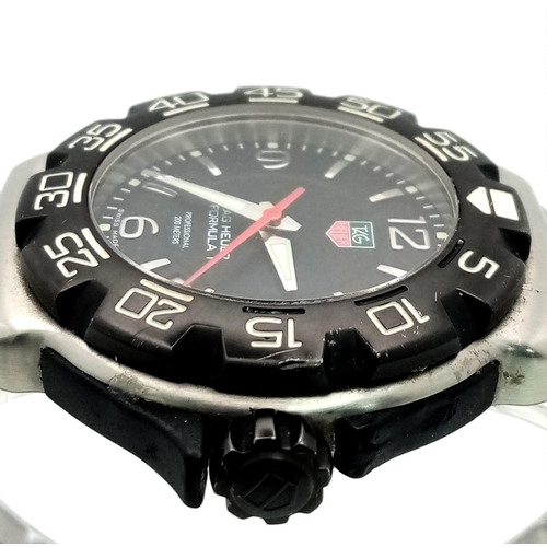 150 - A Tag Heuer Formula 1 Quartz Gents Watch. Stainless steel bracelet and case - 42mm. Black dial with ... 