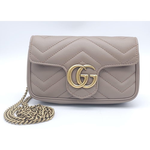 193 - A Gucci Mocha Marmont Mini Crossbody Bag. Matelassé leather exterior, with gold toned hardware and c... 