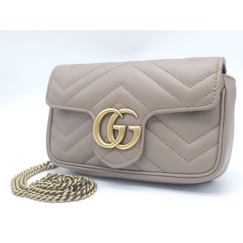 193 - A Gucci Mocha Marmont Mini Crossbody Bag. Matelassé leather exterior, with gold toned hardware and c... 