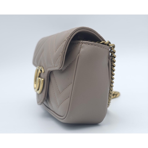 193 - A Gucci Mocha Marmont Mini Crossbody Bag. Matelassé leather exterior, with gold toned hardware and c... 