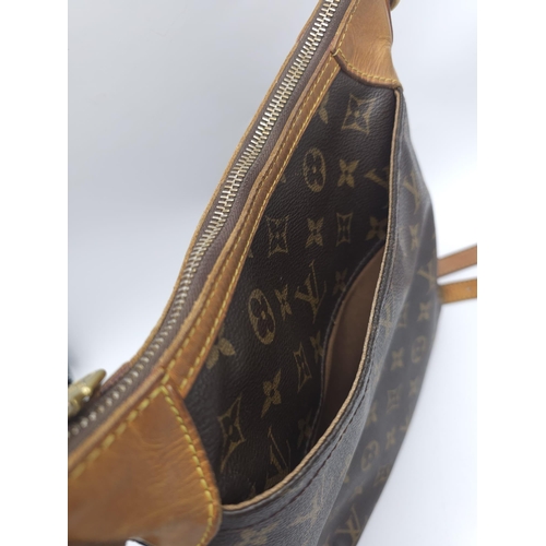 347 - Louis Vuitton Crossover Satchel Bag.
Quality leather exterior with famed LV monogrammed pattern. Ver... 