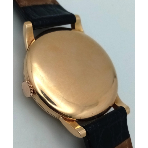 395 - A Vintage 18K Gold Cased International Watch Co. Shaffhausen Gents Watch. Black leather strap. 18k g... 