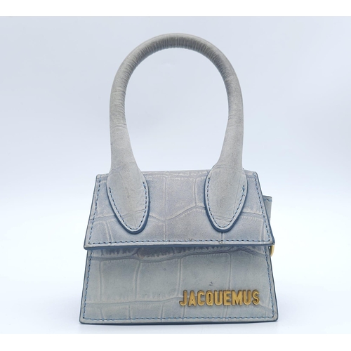 354 - A Jacquemus Duck Egg Blue 'Chiquito' Mini Bag. Croc-embossed leather exterior, with gold toned name ... 