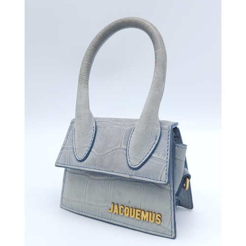 354 - A Jacquemus Duck Egg Blue 'Chiquito' Mini Bag. Croc-embossed leather exterior, with gold toned name ... 