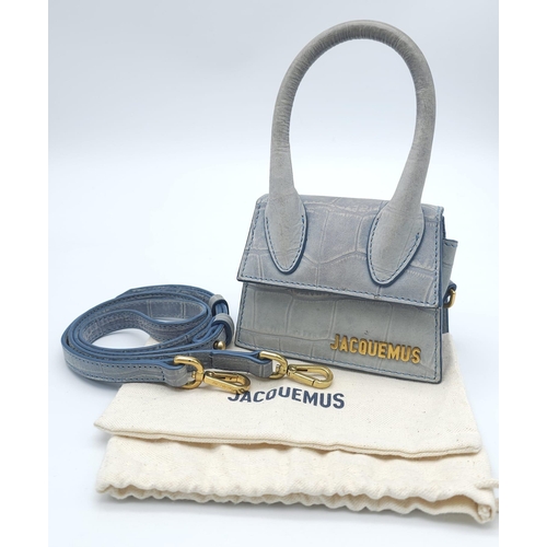 354 - A Jacquemus Duck Egg Blue 'Chiquito' Mini Bag. Croc-embossed leather exterior, with gold toned name ... 