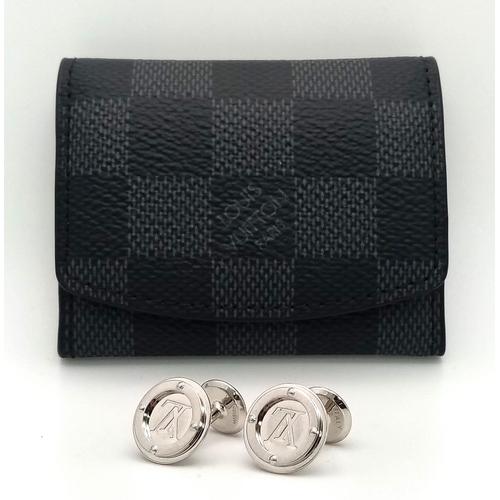 403 - A white metal (untested) LOUIS VUITTON pair of cufflinks in their original designer wallet. REF: 147... 