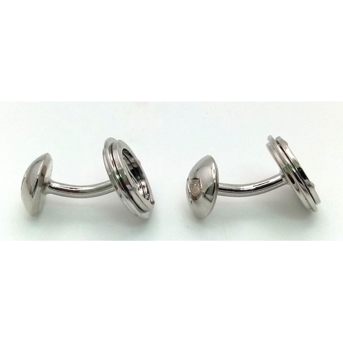 403 - A white metal (untested) LOUIS VUITTON pair of cufflinks in their original designer wallet. REF: 147... 