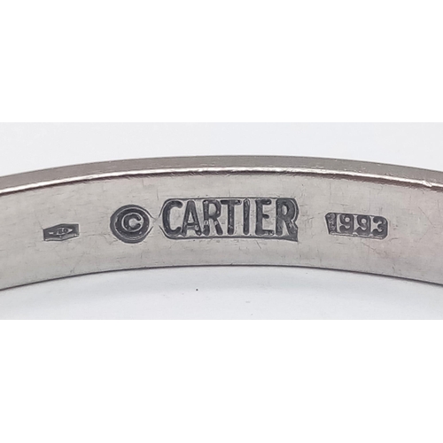 59 - An iconic 18 K white gold CARTIER LOVE bangle in its original presentation box, with the manufacture... 