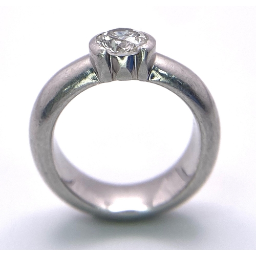 94 - A platinum TIFFANY & CO diamond solitaire ring with the original presentation inner and outer boxes.... 