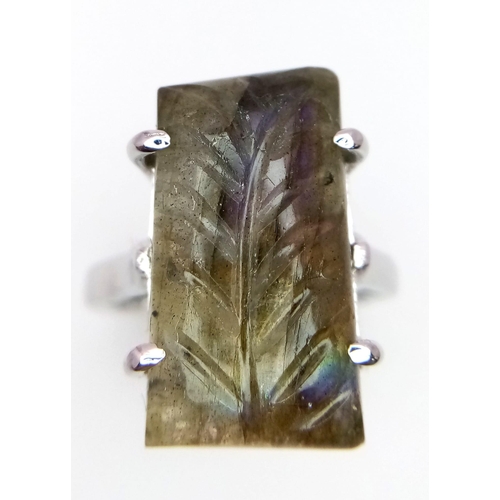 1765 - A Carved Labradorite and 925 Silver Ring. Rectangular step cut. Size P. 8.9g total weight. Comes wit... 