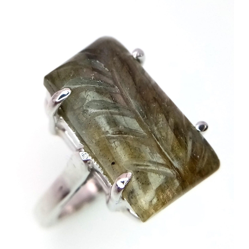 1765 - A Carved Labradorite and 925 Silver Ring. Rectangular step cut. Size P. 8.9g total weight. Comes wit... 