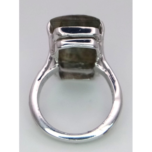 1765 - A Carved Labradorite and 925 Silver Ring. Rectangular step cut. Size P. 8.9g total weight. Comes wit... 