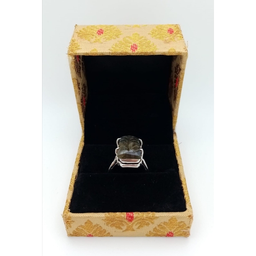 1765 - A Carved Labradorite and 925 Silver Ring. Rectangular step cut. Size P. 8.9g total weight. Comes wit... 