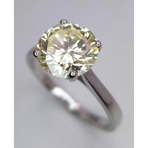 144 - An 18K White Gold and 2.47ct VVS Yellow Diamond Ring. A brilliant round cut dancing centrepiece - No... 