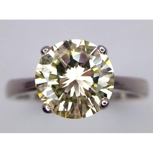 144 - An 18K White Gold and 2.47ct VVS Yellow Diamond Ring. A brilliant round cut dancing centrepiece - No... 