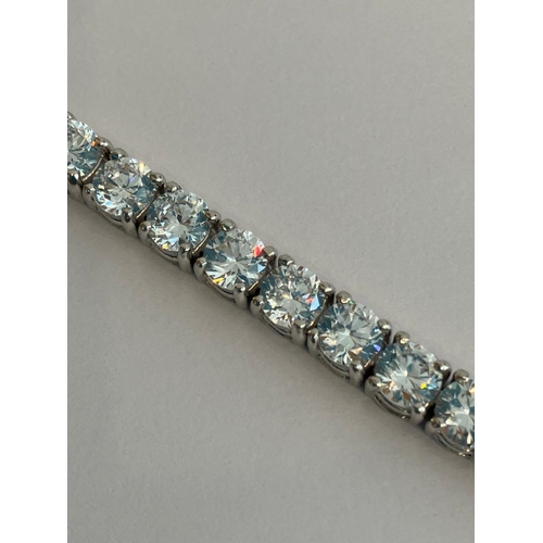 182 - SILVER TENNIS BRACELET Set with 37 sparkling Clear Gemstones. 20 cm.