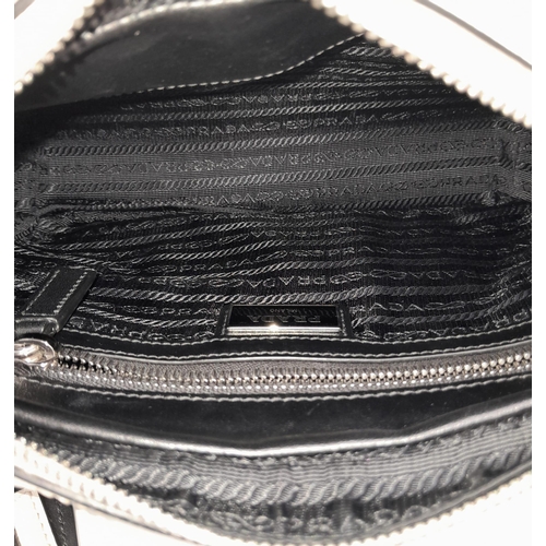 206 - Prada Top Zip Casual Bag. 
Quality leather exterior with Prada Milano detail on front. Comes with a ... 