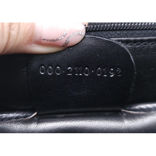 213 - Black Gucci Top Handle Bag.
Exotic, shiny lizard leather featuring gold toned hardware, flip-lock cl... 