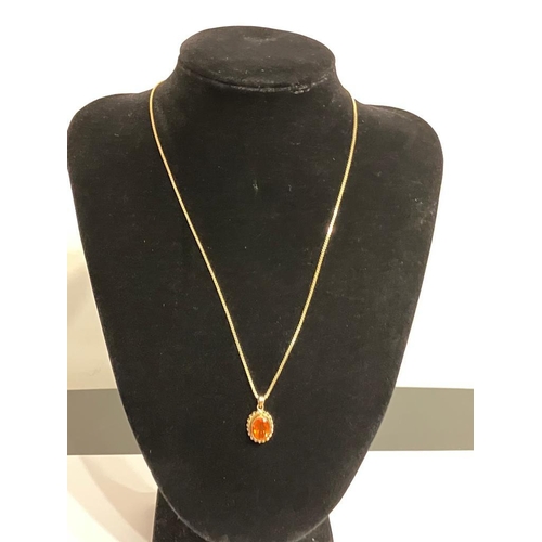 245 - Stunning 9 carat GOLD PENDANT set with a MANDARIN GARNET. Oval cut and mounted on a 9 carat GOLD BOX... 