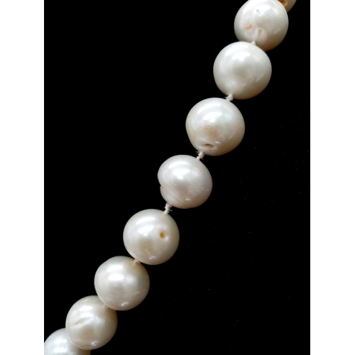 269 - A very glamorous vintage pearl necklace with a beautiful yellow gold asymmetric clasp loaded with ro... 