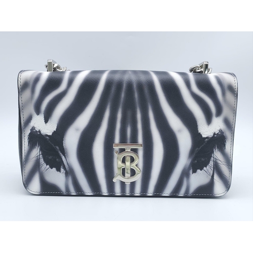 286 - Burberry Zebra Chain Shoulder Bag.
Quality leather throughout with a gorgeous print of a Zebra. Defi... 