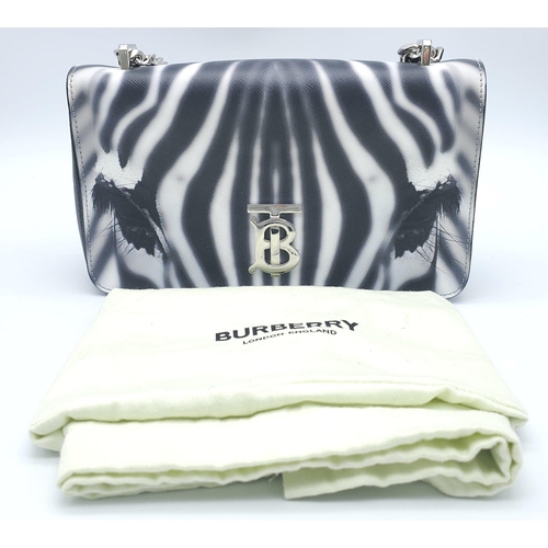 286 - Burberry Zebra Chain Shoulder Bag.
Quality leather throughout with a gorgeous print of a Zebra. Defi... 