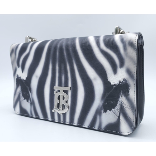 286 - Burberry Zebra Chain Shoulder Bag.
Quality leather throughout with a gorgeous print of a Zebra. Defi... 