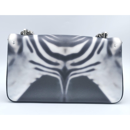 286 - Burberry Zebra Chain Shoulder Bag.
Quality leather throughout with a gorgeous print of a Zebra. Defi... 